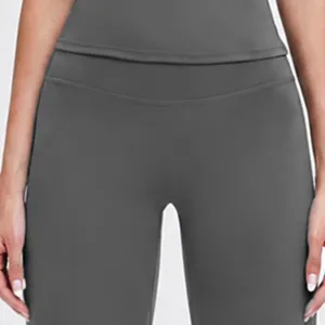 High-waist dark gray flare yoga pants detail, soft stretch fabric for fitness and workout.