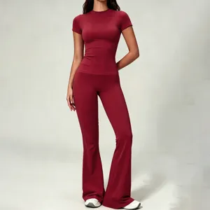 Maroon slim short sleeve top and high waist flared yoga pants set, perfect for fitness workouts.