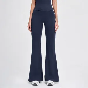 Closeup of dark blue high waist flare yoga pants, fitted slim design for women sports wear.