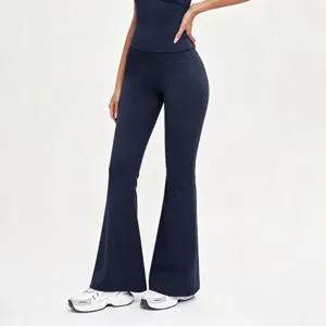 Detailed view of women's navy blue high-waisted micro flare yoga pants, fit and stretch.