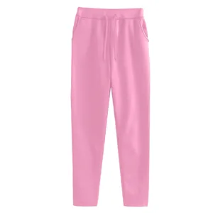 Pink drawstring sweatpants for women, casual fleece-lined trousers with pockets for daily wear.