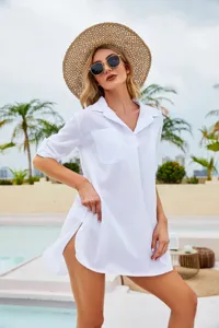 White beach shirt cover-up detail, casual resort style, deep V-neck and split hem design.