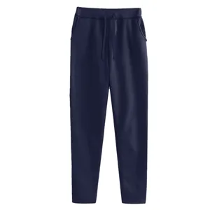 Solid color fleece lined casual sweatpants for men and women with drawstring waist and pockets.