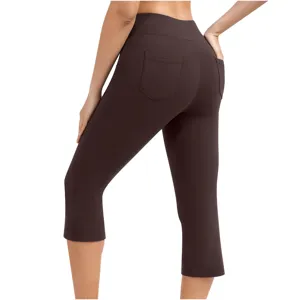 Detail view of women's brown high-waist yoga capri pants featuring a stylish back patch pocket.