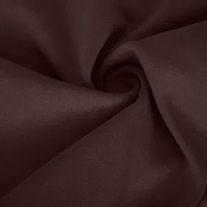Dark brown yoga pants fabric detail, premium high stretch material texture closeup.