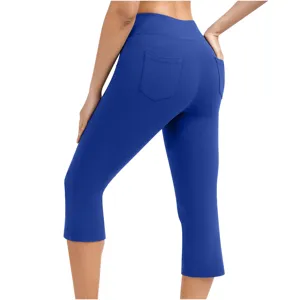 Women royal blue high waist cropped yoga leggings with back pockets for fitness sports workout.