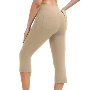 Back view detail of women's high-waist solid color yoga cropped pants with back pockets.