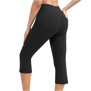 Back pocket detail view of high waist solid black yoga capri pants for women fitness workout.