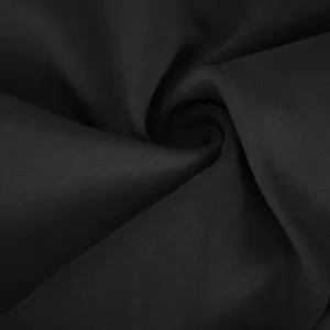 High elasticity black yoga pants fabric close-up showcasing fine texture and soft feel.
