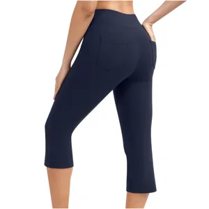 High waist cropped yoga pants for women with back pockets in solid dark blue color.