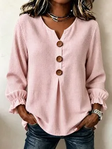 Women pink waffle knit long sleeve top with V-neck wooden buttons and ruffled cuffs casual