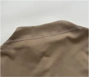 Detailed view of women athletic yoga jacket collar stitching, elastic workout activewear top.