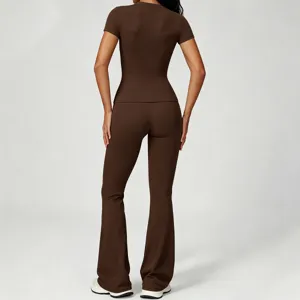 Detail view of the brown flare yoga pants and short sleeve top set, showcasing the slim fit back.