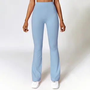 High waisted light blue flare yoga pants detail showing slim fit and comfortable stretch fabric.