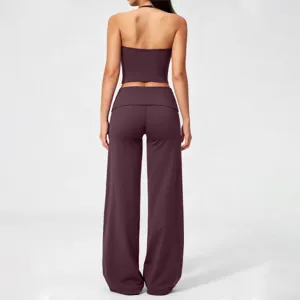 Detailed back view of women halter crop top and fold-over wide leg yoga pants set.