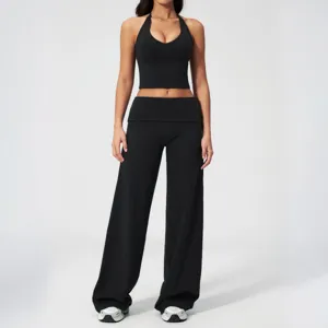 Black halter crop top and wide-leg yoga pants set, elastic slim fit fitness activewear.