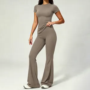 Detail view of women soft brushed short sleeve top and high waist flared yoga pants set.
