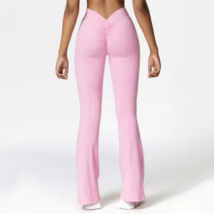 Pink high-waisted V-waist bootcut yoga pants with scrunch butt detail for fitness workout.