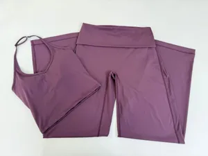 Halterneck yoga set detail showing the elegant fold-over waistband wide-leg pants and crop top.