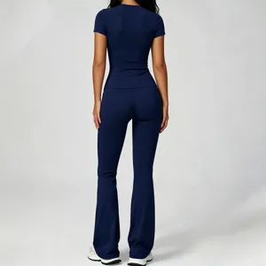 Women's slim short sleeve yoga top and high waist flare pants fitness set, back view.