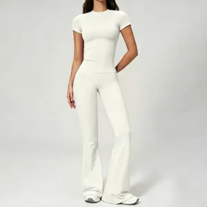 Brushed bare-feeling yoga set with slim short-sleeve top and high-waist flared pants.