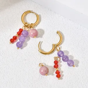Detailed view of handmade DIY natural stone hoop earrings with gold plated charms.