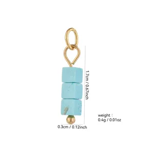 Close-up detail of natural stone cubic beads pendant with 18k gold plated ring accessory.