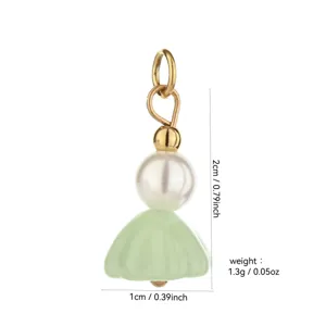 Detailed close-up view of the 18K gold-plated DIY pearl and green dress pendant charm.