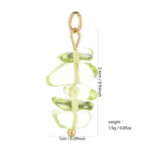 Detailed close-up view of the green beaded pendant accessory showing precise size and weight specs.