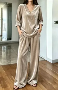 Velvet V-neck top and wide leg pants set detail shot, elegant lounge wear fashion style.