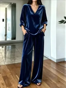 Elegant velvet two piece lounge set featuring a chic V-neck top and comfortable wide leg pants.