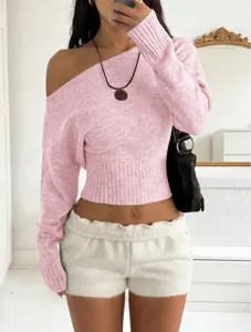 Detail view of a pink off-the-shoulder knit crop top paired with cozy fuzzy shorts.