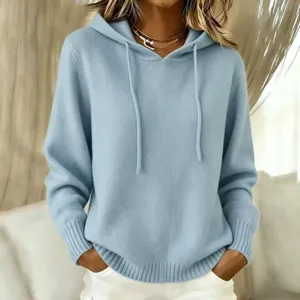Light blue knit hooded sweater detail, cozy casual pullover with pocket and drawstring style.