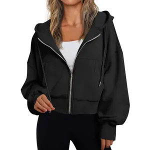 Detailed view of black zip-up hoodie featuring metallic zipper and comfortable hood.