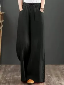 Detail view of the black ramie wide-leg pants, showing the elastic drawstring waist.