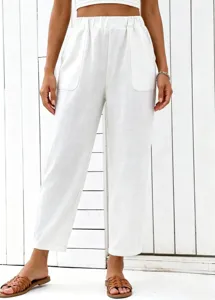 Detail view of white high-waisted casual straight leg trousers and trendy crop top set.