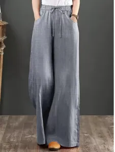 Close-up detail of women high waist drawstring wide leg linen casual pants relaxed fit