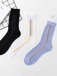 Detail view of thin nylon mid-calf socks with vertical stripe pattern and elegant decorative lines.