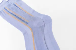 Detail view of light purple thin men socks with decorative knit pattern, neat and soft fabric.
