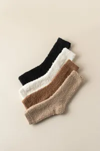 Detail view of soft coral fleece over the knee warm leg socks in four cozy colors.