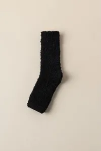 Black coral fleece cozy sock detail view, soft fuzzy winter leg warmer close up.
