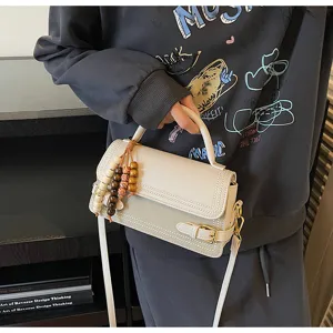 Trendy women shoulder crossbody bag 2025 new chic square handbag with cute beaded charm detail.