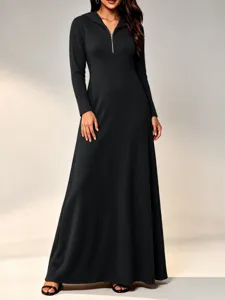 Black long sleeve hooded maxi dress with ribbed knit texture and half zip detail.