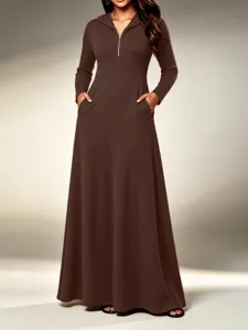 Long sleeve hooded maxi dress featuring ribbed knit fabric, front zip and side pockets.