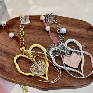 Y2K handmade ribbon heart pendant necklace detail, stylish bead and flower charms for women.