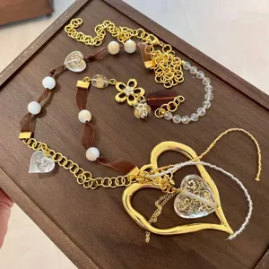 Y2K style handmade ribbon spliced crystal heart sweater chain detail, retro chic necklace.