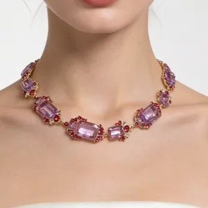 Close-up of a vintage royal style purple crystal necklace worn on the neck, elegant design.