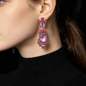 Detailed close-up view of vintage baroque purple crystal drop earrings with rhinestones.