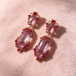Vintage court style drop earrings featuring large purple crystal and red rhinestone details.