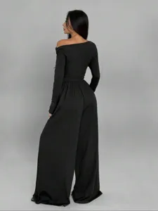 Detailed back view of the elegant black off-shoulder long sleeve wide-leg jumpsuit, soft fabric.